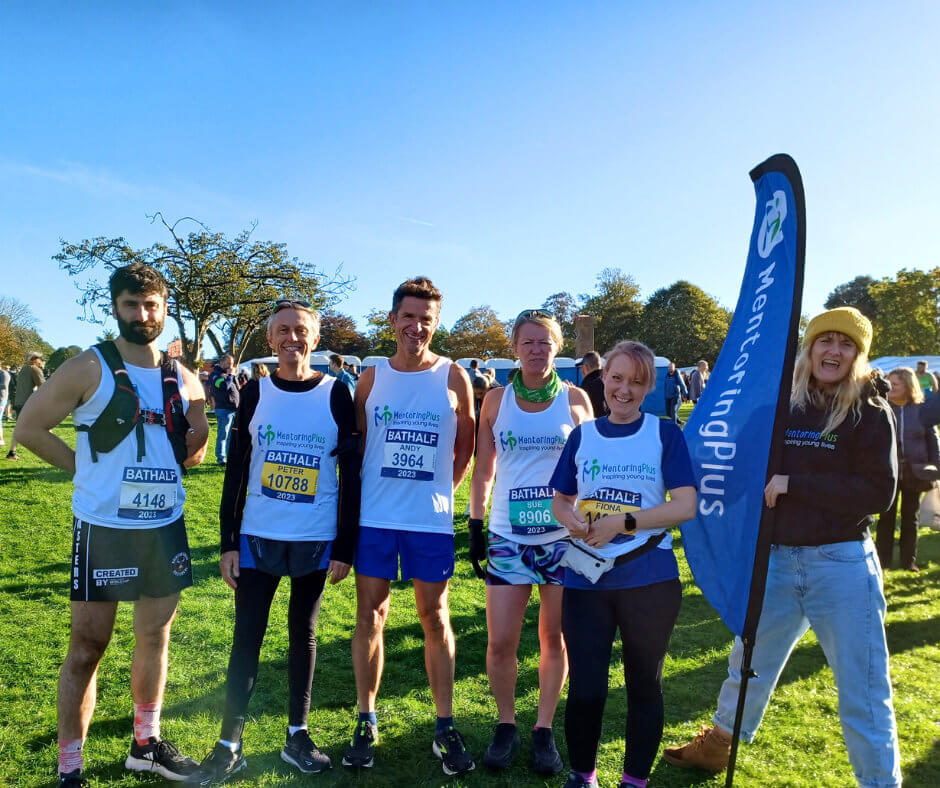 Mentoring Plus runners wearing race numbers at the Bath Half Marathon