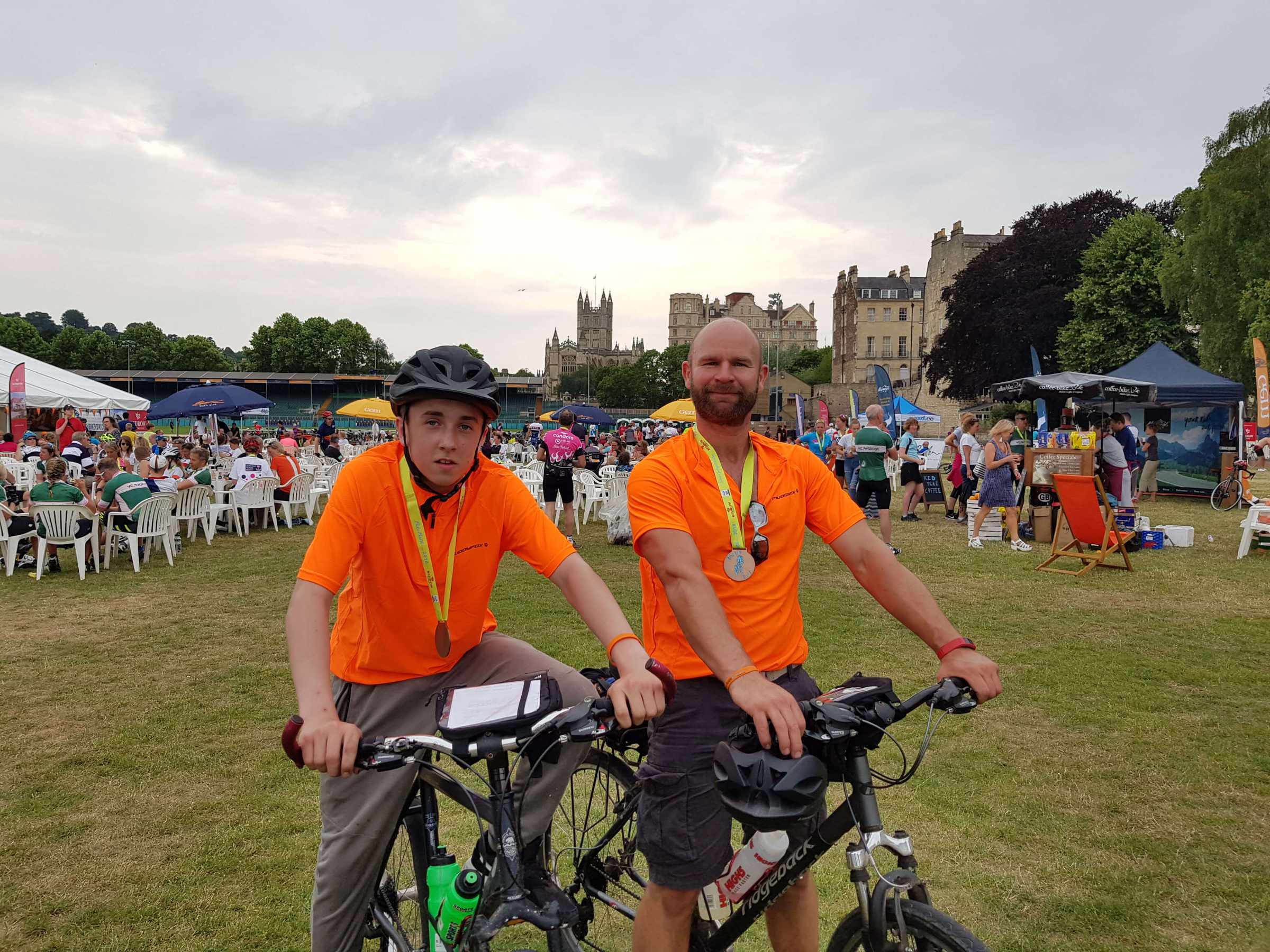 A mentor and mentee on bikes fundraising together at Bike Bath