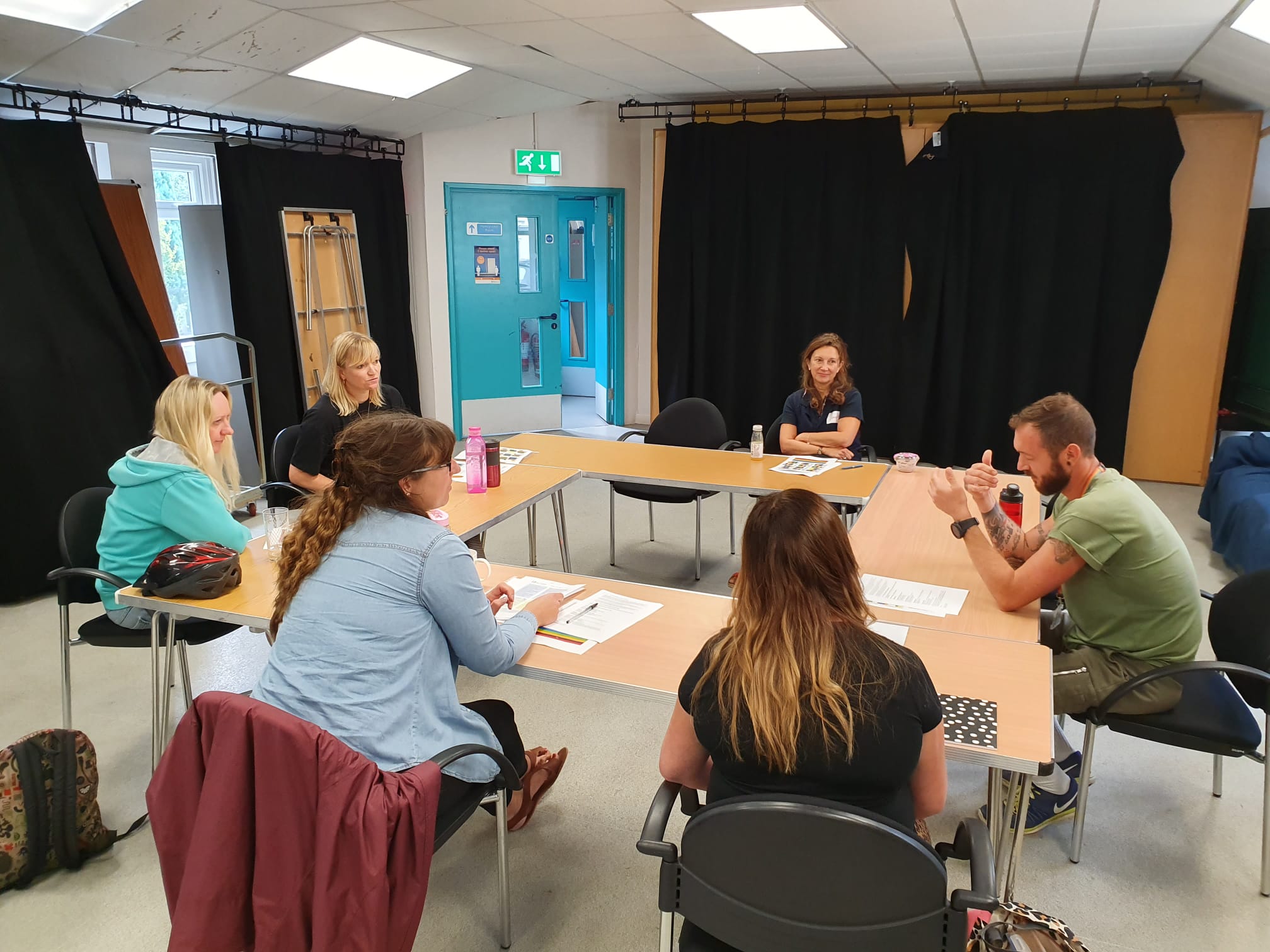 Mentoring Plus staff and volunteers taking part in a team training session