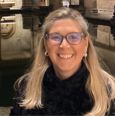 Photo of Louisa smiling at the camera