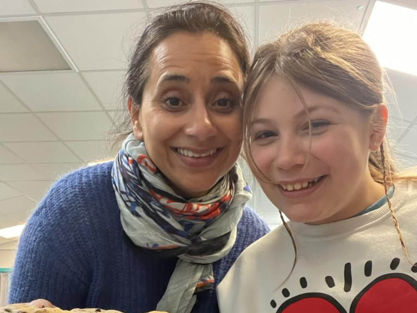 A mentor and mentee spending time together smiling at the camera