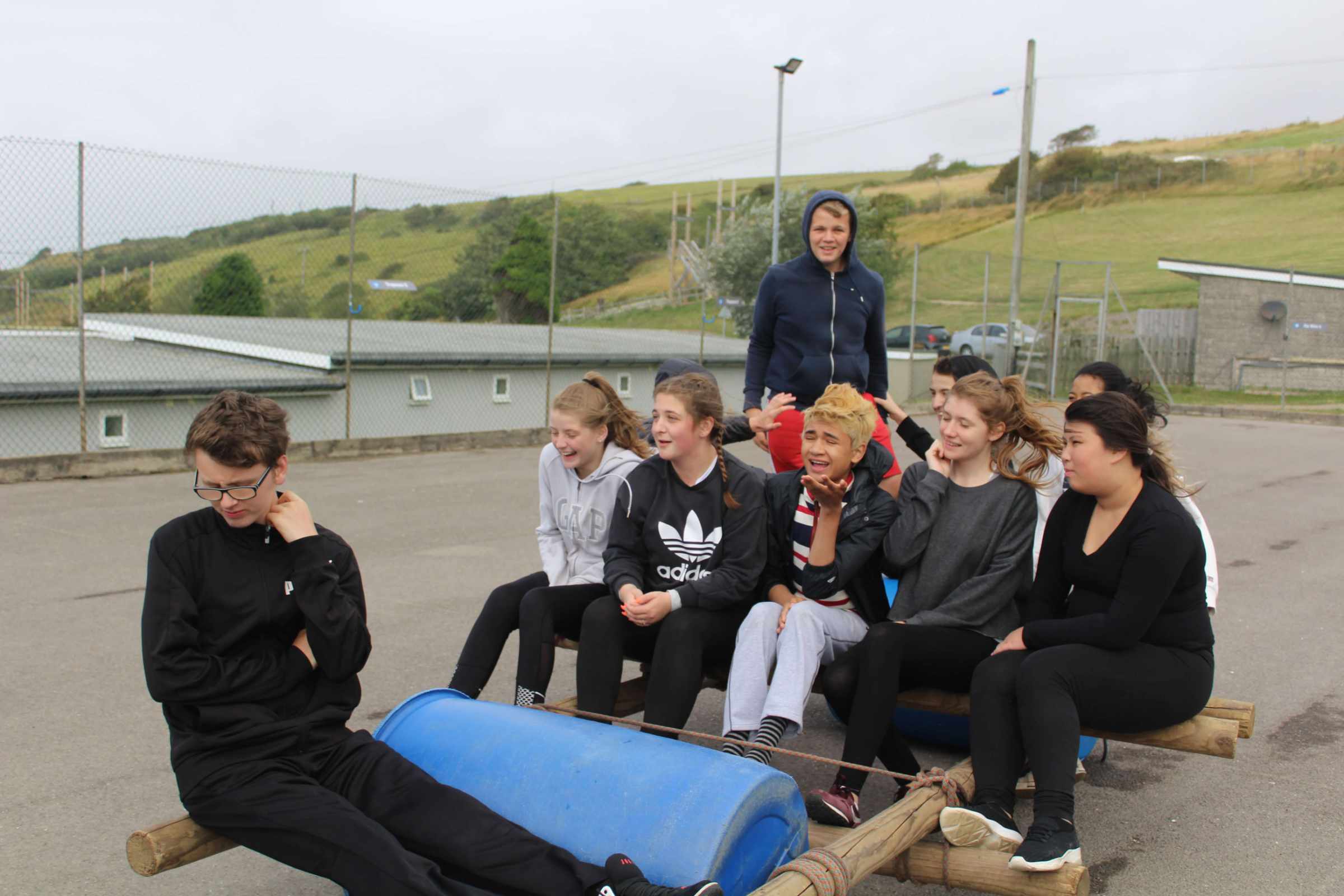 Young people taking part in a raft-making activity