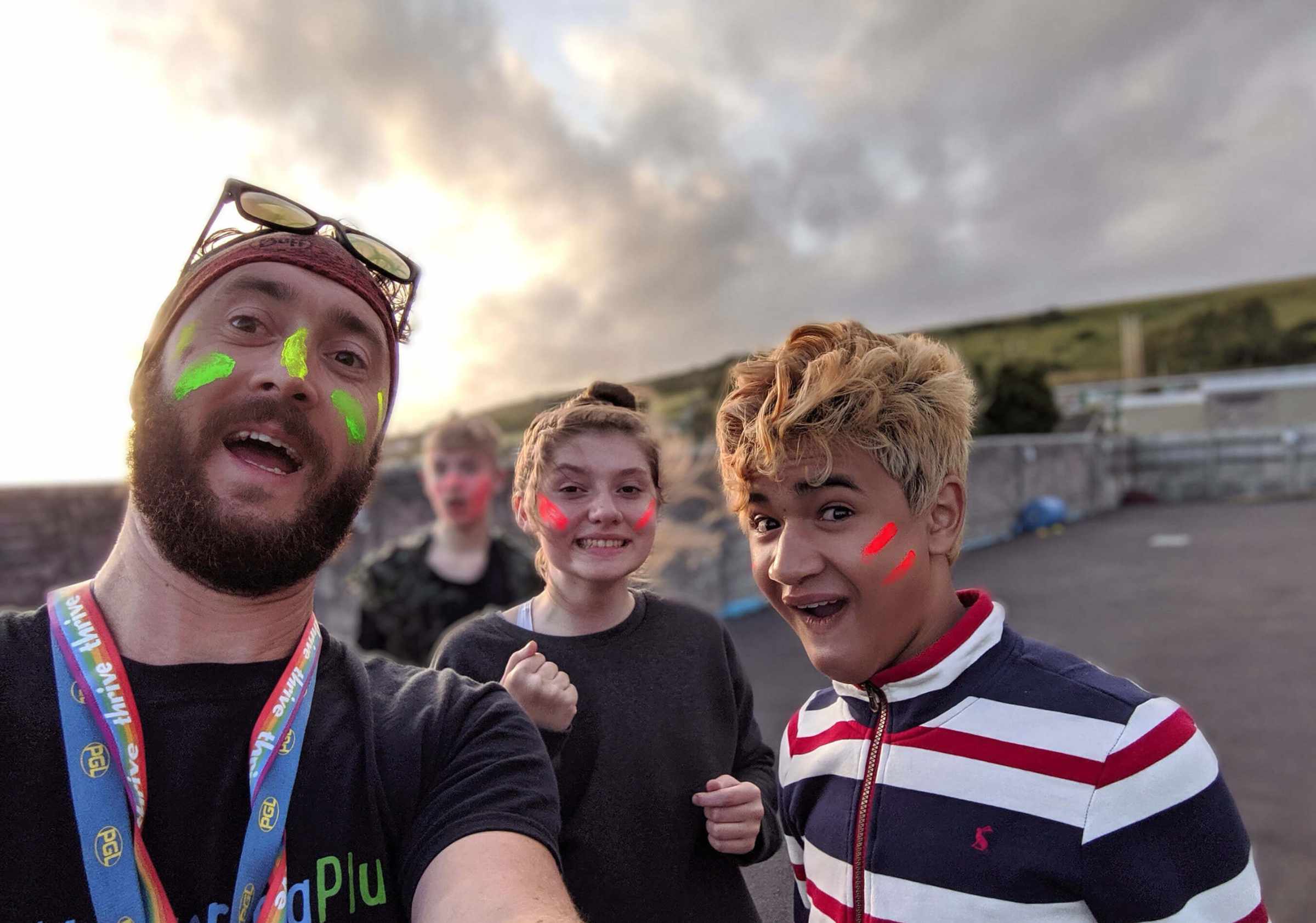 Practitioner And Young People In Face Paint